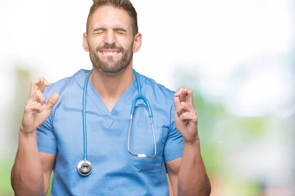 Handsome Young Doctor Surgeon Man Isolated Background Smiling Crossing Fingers — Stock Photo, Image