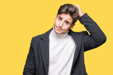 Zarif delikanlı giyen kış ceket izole arka plan üzerinde yanıltır ve soru hakkında merak ediyorum. Şüphe, kafasına el ile düşünme ile belirsiz. Dalgın kavramı.