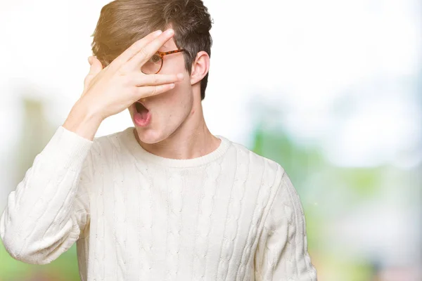 Young Handsome Man Wearing Glasses Isolated Background Peeking Shock Covering — Stock Photo, Image