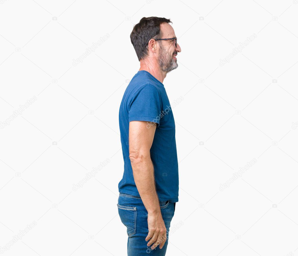 Handsome middle age hoary senior man wearin glasses over isolated background looking to side, relax profile pose with natural face with confident smile.