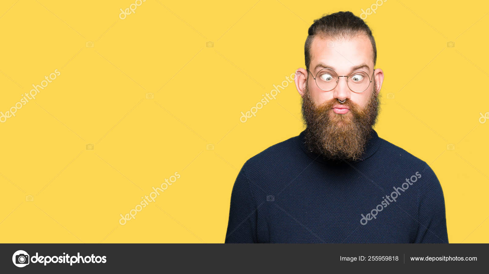 A man with a goatee and a turtle neck sweater photo – Man face