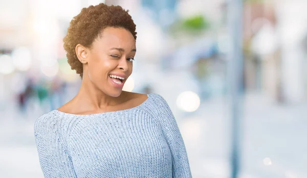 Young Beautiful African American Woman Wearing Sweater Isolated Background Winking — Stock Photo, Image