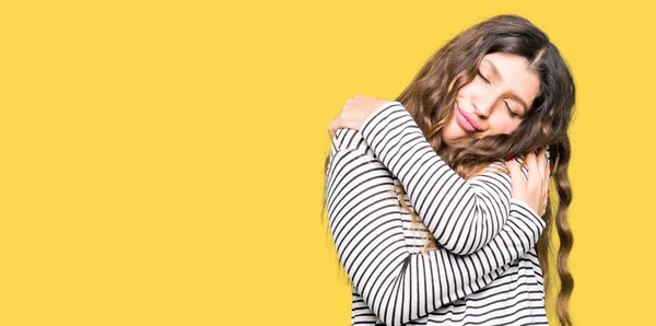 Young Beautiful Woman Wearing Stripes Sweater Hugging Oneself Happy Positive — Stock Photo, Image