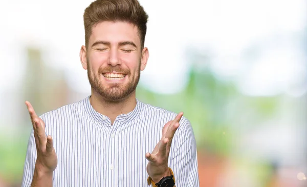 Young Handsome Man Celebrating Mad Crazy Success Arms Raised Closed — Stock Photo, Image