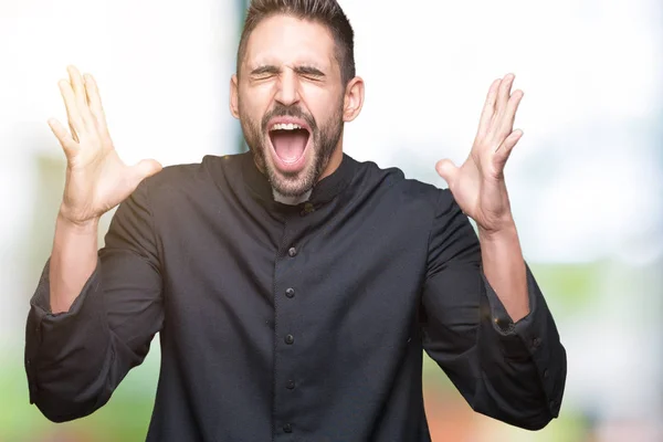 Young Christian Priest Isolated Background Celebrating Mad Crazy Success Arms — Stock Photo, Image