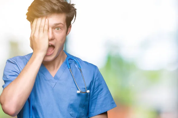 Young Doctor Wearing Medical Uniform Isolated Background Covering One Eye — Stock Photo, Image