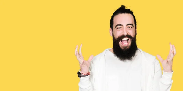 Young Man Long Hair Beard Wearing Sporty Sweatshirt Celebrating Crazy — Stock Photo, Image