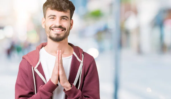 Young Handsome Man Isolated Background Praying Hands Together Asking Forgiveness — Stock Photo, Image