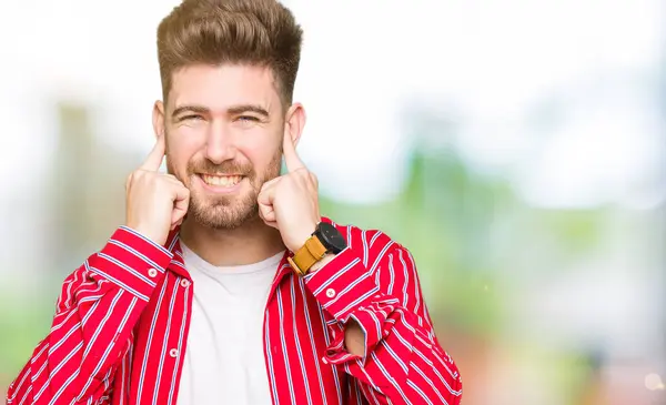 Young Handsome Man Wearing Red Shirt Covering Ears Fingers Annoyed — Stock Photo, Image