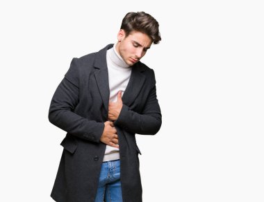 Genç zarif adam giyen kış ceket mide üzerinde el ile izole arka plan üzerinde çünkü mide bulantısı, ağrılı hastalık hasta hissediyor. Ağrısı kavramı.