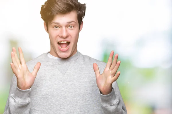 Young Handsome Sporty Man Wearing Sweatshirt Isolated Background Celebrating Crazy — Stock Photo, Image