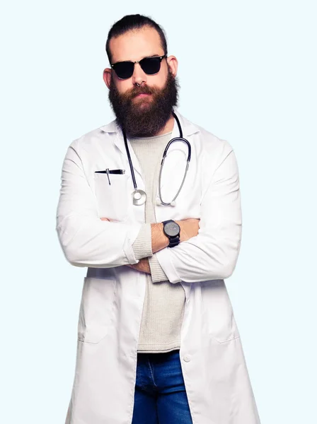 Young Blond Doctor Man Beard Wearing Sunglasses Skeptic Nervous Disapproving — Stock Photo, Image