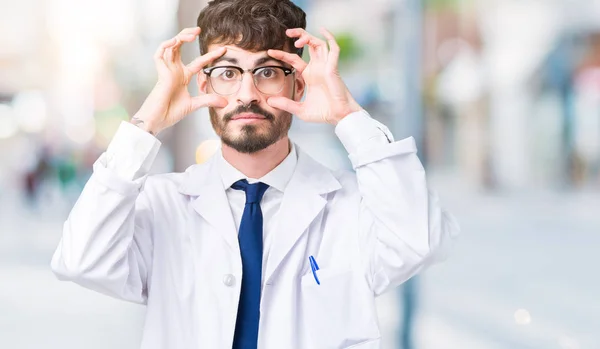 Young Professional Scientist Man Wearing White Coat Isolated Background Trying — Stock Photo, Image