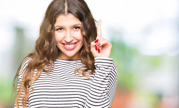 Young Beautiful Woman Wearing Stripes Sweater Showing Pointing Finger Number — Stock Photo, Image