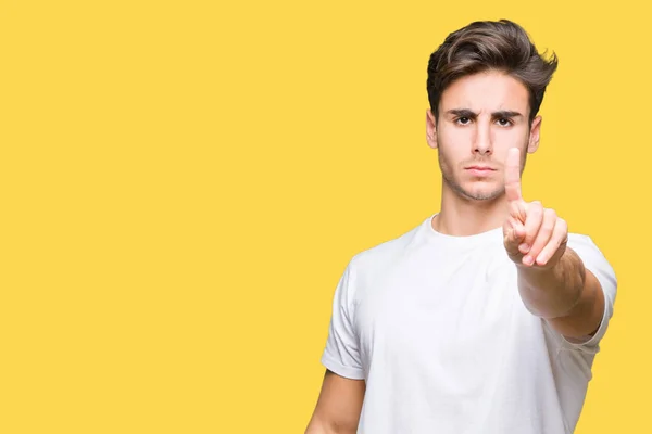 Jovem Homem Bonito Vestindo Camiseta Branca Sobre Fundo Isolado Apontando — Fotografia de Stock