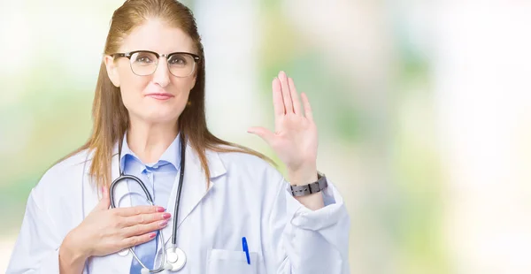 Middle age mature doctor woman wearing medical coat over isolated background Swearing with hand on chest and open palm, making a loyalty promise oath