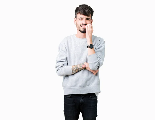 Joven Hombre Guapo Con Sudadera Sobre Fondo Aislado Mirando Estresado —  Fotos de Stock