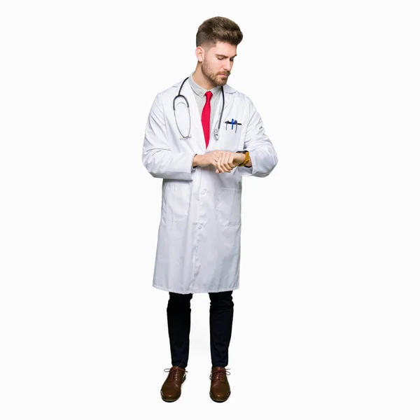 Young Handsome Doctor Man Wearing Medical Coat Checking Time Wrist — Stock Photo, Image