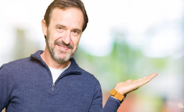 Middle Age Handsome Man Wearing Sweater Smiling Cheerful Presenting Pointing — Stock Photo, Image