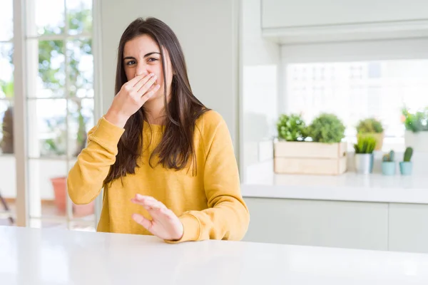 Beautiful Young Woman Wearing Yellow Sweater Smelling Something Stinky Disgusting — Stock Photo, Image