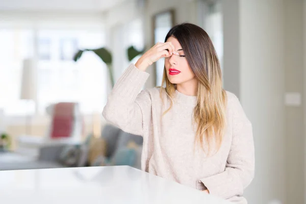 Young Beautiful Woman Wearing Winter Sweater Home Tired Rubbing Nose — Stock Photo, Image