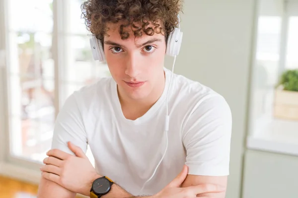 Young Man Listening Music Wearing Headphones Homes Relaxed Serious Expression — Stock Photo, Image