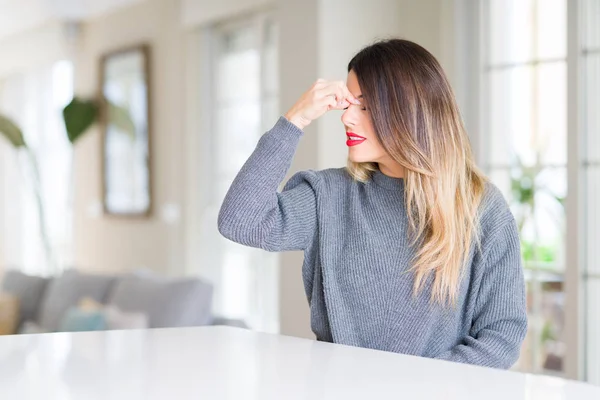 Young Beautiful Woman Wearing Winter Sweater Home Tired Rubbing Nose — Stock Photo, Image