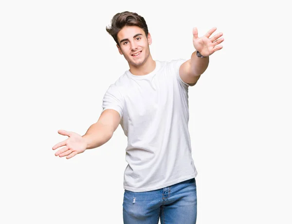 Joven Hombre Guapo Con Camiseta Blanca Sobre Fondo Aislado Mirando —  Fotos de Stock
