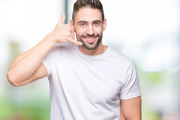 Hombre Joven Que Usa Una Camiseta Blanca Casual Sobre Fondo —  Fotos de Stock