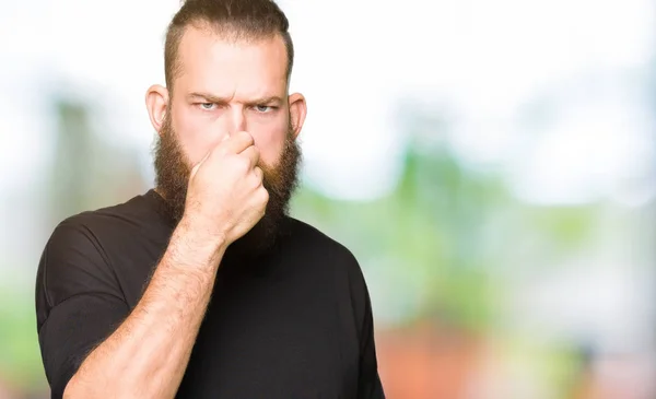 Young Blond Man Wearing Casual Shirt Smelling Something Stinky Disgusting — Stock Photo, Image