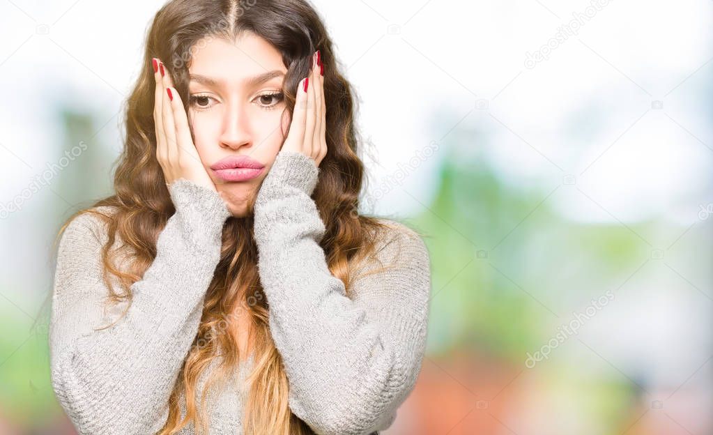 Young beautiful woman wearing winter dress Tired hands covering face, depression and sadness, upset and irritated for problem
