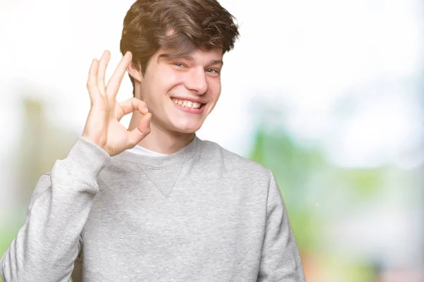 Joven Hombre Deportivo Guapo Con Sudadera Sobre Fondo Aislado Sonriendo —  Fotos de Stock