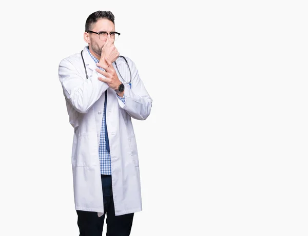 Handsome Young Doctor Man Isolated Background Smelling Something Stinky Disgusting — Stock Photo, Image