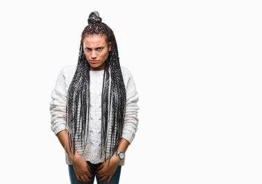 Young braided hair african american girl wearing sweater over isolated background skeptic and nervous, frowning upset because of problem. Negative person. clipart