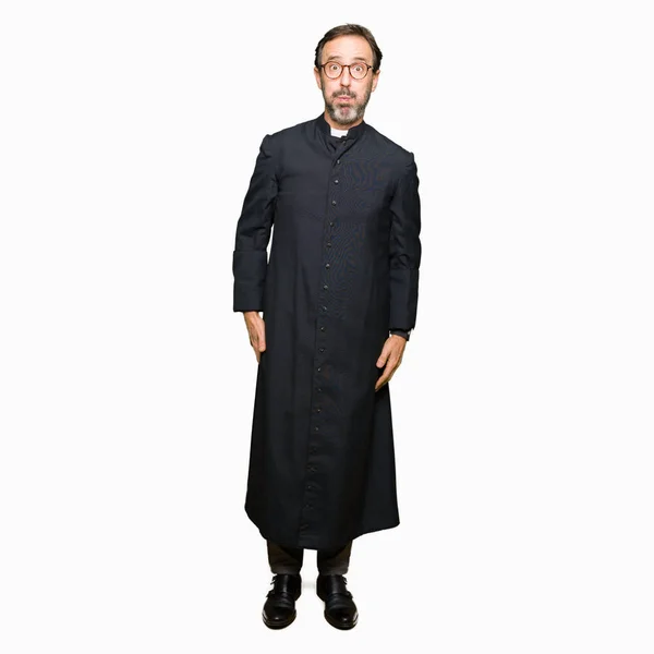Homem Padre Meia Idade Vestindo Robe Católico Soprando Bochechas Com — Fotografia de Stock