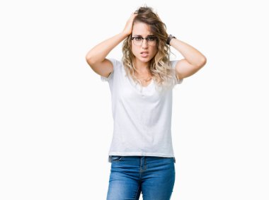 Beautiful young blonde woman wearing glasses over isolated background suffering from headache desperate and stressed because pain and migraine. Hands on head.