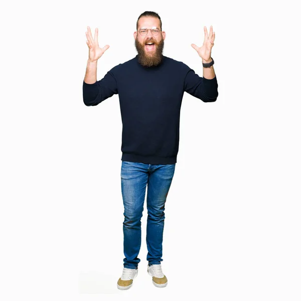 Young Blond Man Wearing Glasses Turtleneck Sweater Celebrating Crazy Amazed — Stock Photo, Image