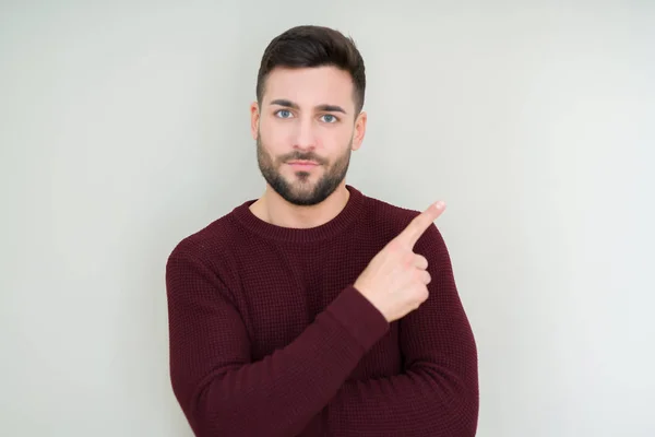 Jonge Knappe Man Draagt Een Trui Geïsoleerde Achtergrond Wijzend Met — Stockfoto