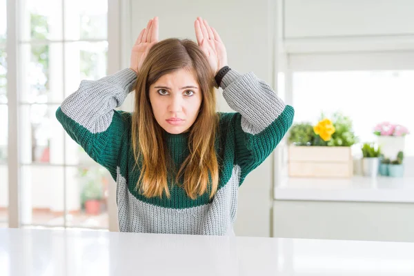 Young Beautiful Size Woman Wearing Casual Striped Sweater Doing Bunny — Stock Photo, Image