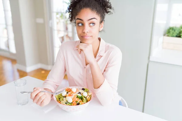Young African American Woman Eating Healthy Pasta Salad Serious Face — Stock Photo, Image