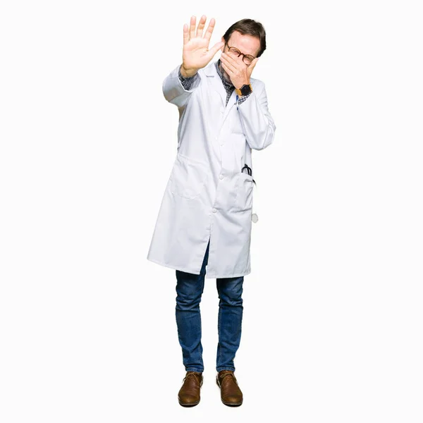 Middle Age Doctor Men Wearing Medical Coat Covering Eyes Hands — Stock Photo, Image