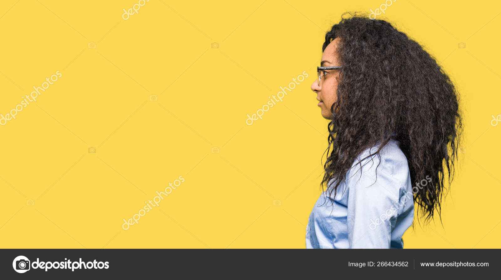 Young Beautiful Business Girl Curly Hair Wearing Glasses Looking