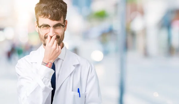 Young Professional Scientist Man Wearing White Coat Isolated Background Smelling — Stock Photo, Image