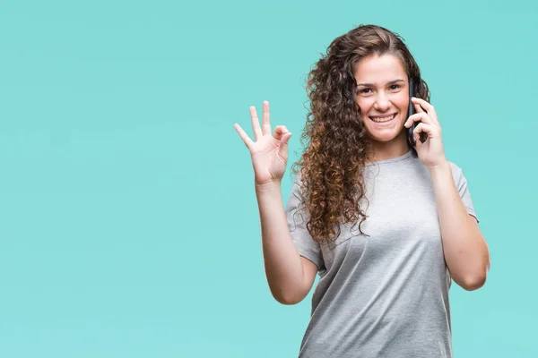 Young Brunette Girl Talking Smartphone Isolated Background Doing Sign Fingers — Stock Photo, Image