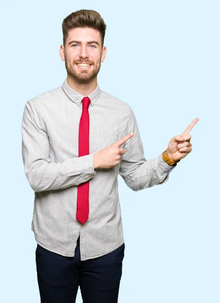 Joven Hombre Negocios Guapo Sonriendo Mirando Cámara Apuntando Con Dos —  Fotos de Stock