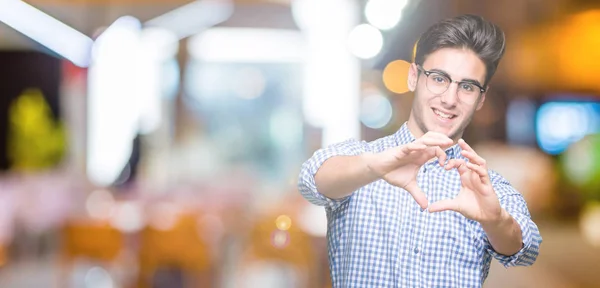 Joven Hombre Guapo Con Gafas Sobre Fondo Aislado Sonriendo Amor —  Fotos de Stock