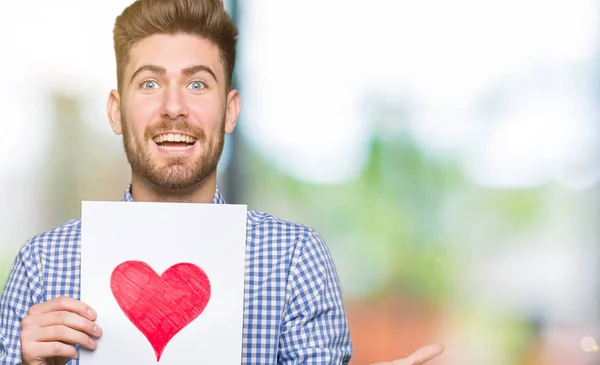 Junger Gutaussehender Mann Mit Rotem Herzen Sehr Glücklich Und Aufgeregt — Stockfoto