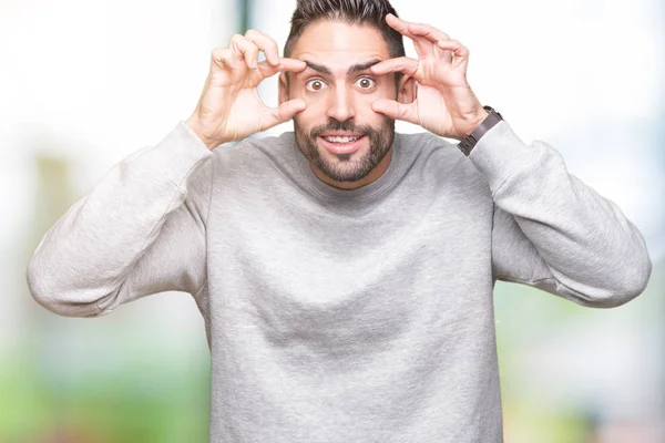 Jovem Homem Bonito Vestindo Camisola Sobre Fundo Isolado Tentando Abrir — Fotografia de Stock