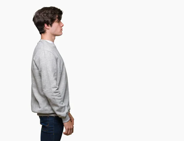Młody Przystojny Mężczyzna Sportowy Bluza Noszenia Białym Tle Patrząc Bok — Zdjęcie stockowe