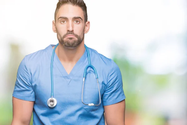 Bello Giovane Medico Chirurgo Uomo Sfondo Isolato Depresso Preoccupazione Angoscia — Foto Stock